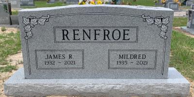 granite headstone for husband and wife with ivy border